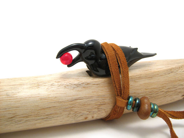 Raven Stealing the Sun: flute block, glass bird by Wesley Fleming